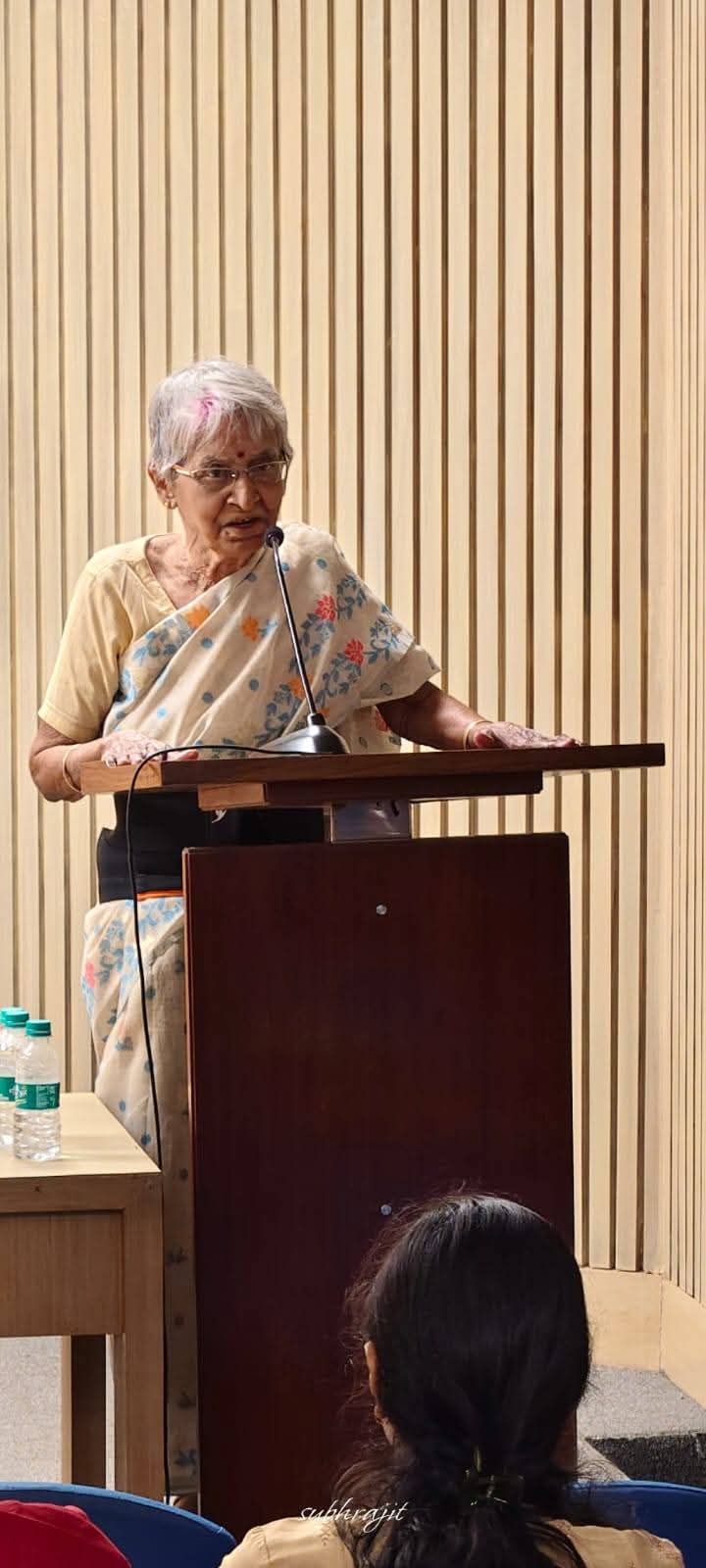 Speaker reciting at the podium