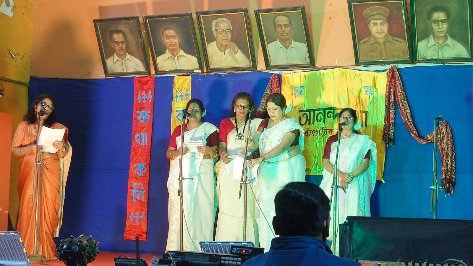 Women performing group recitation at the annual programme